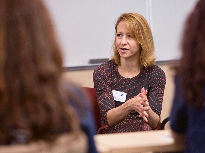 Female faculty member advising students