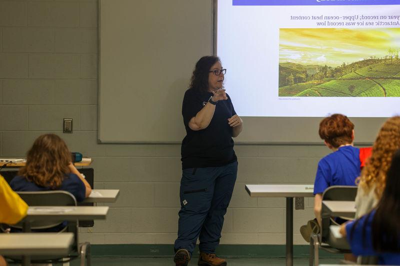 Laura Guertin speaking with students