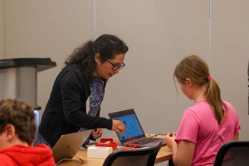 Shruti Shrestha helping student in workshop