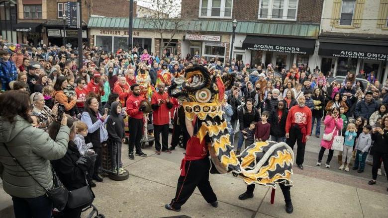 group of people watching dragon dance in 媒体, PA